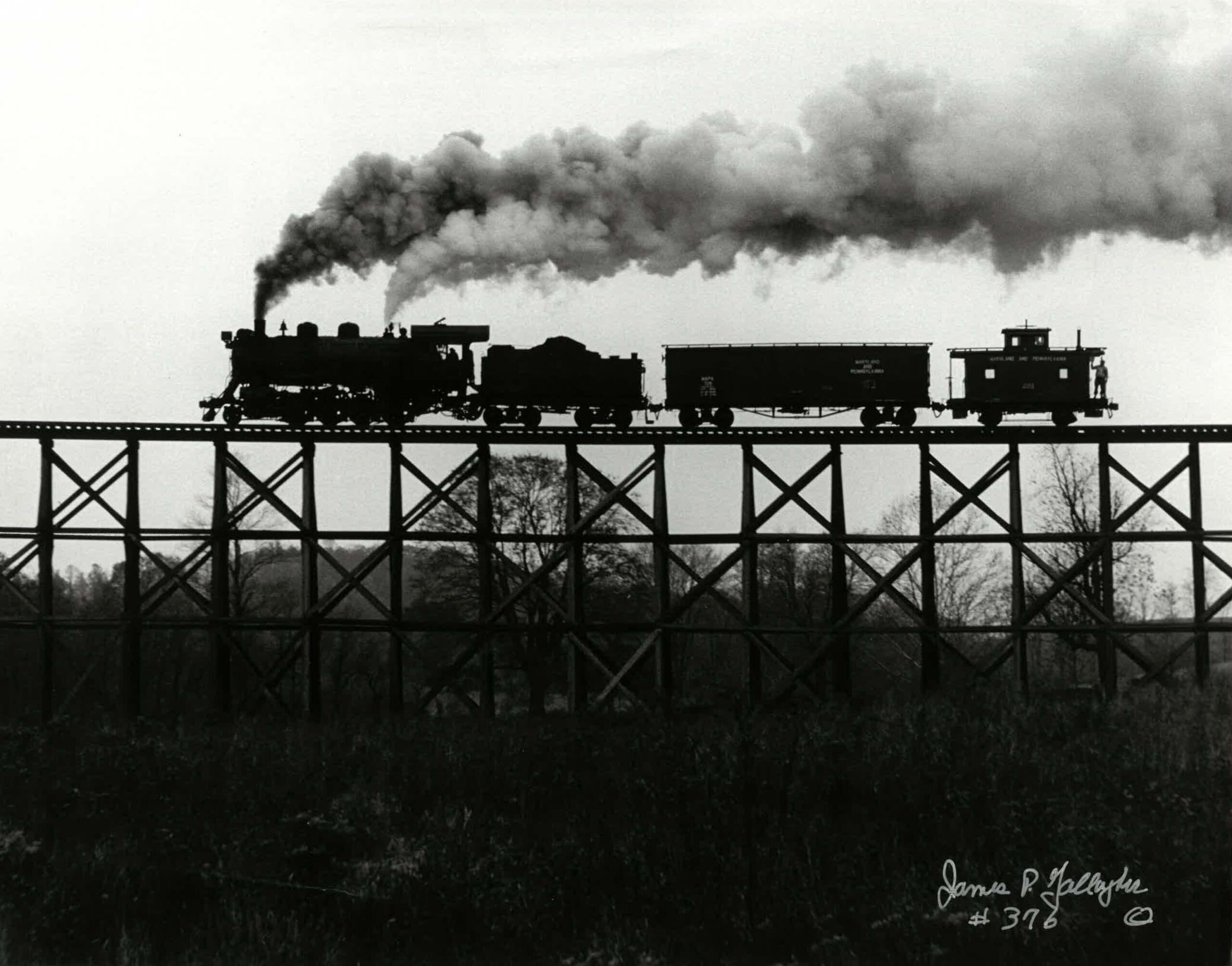 old photo stream train on bridge
